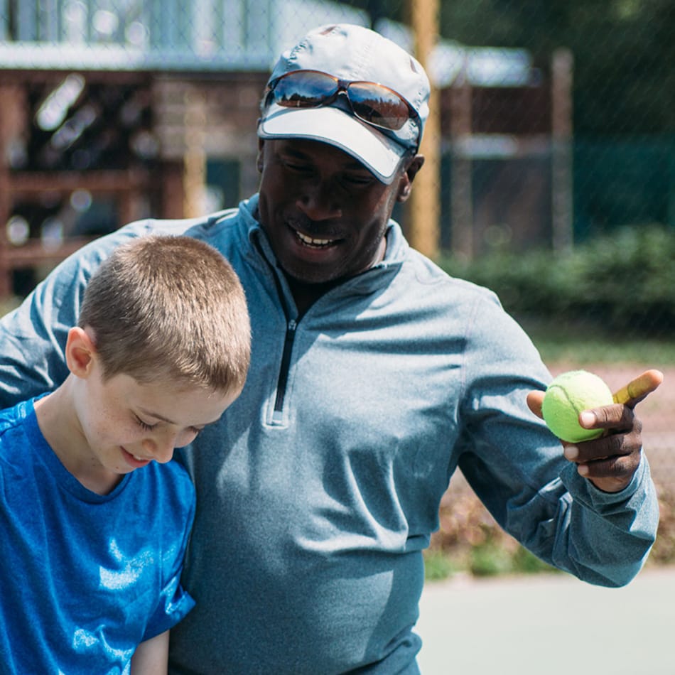 Tennis Lloyd and Alvy tennis ball smile