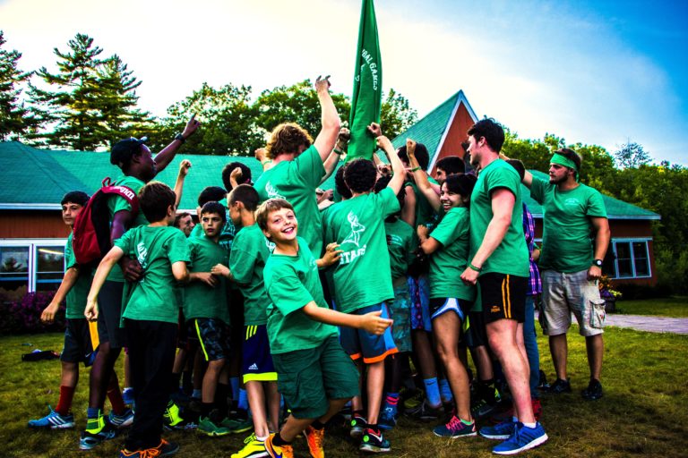 gathering of boys in green group brotherhood
